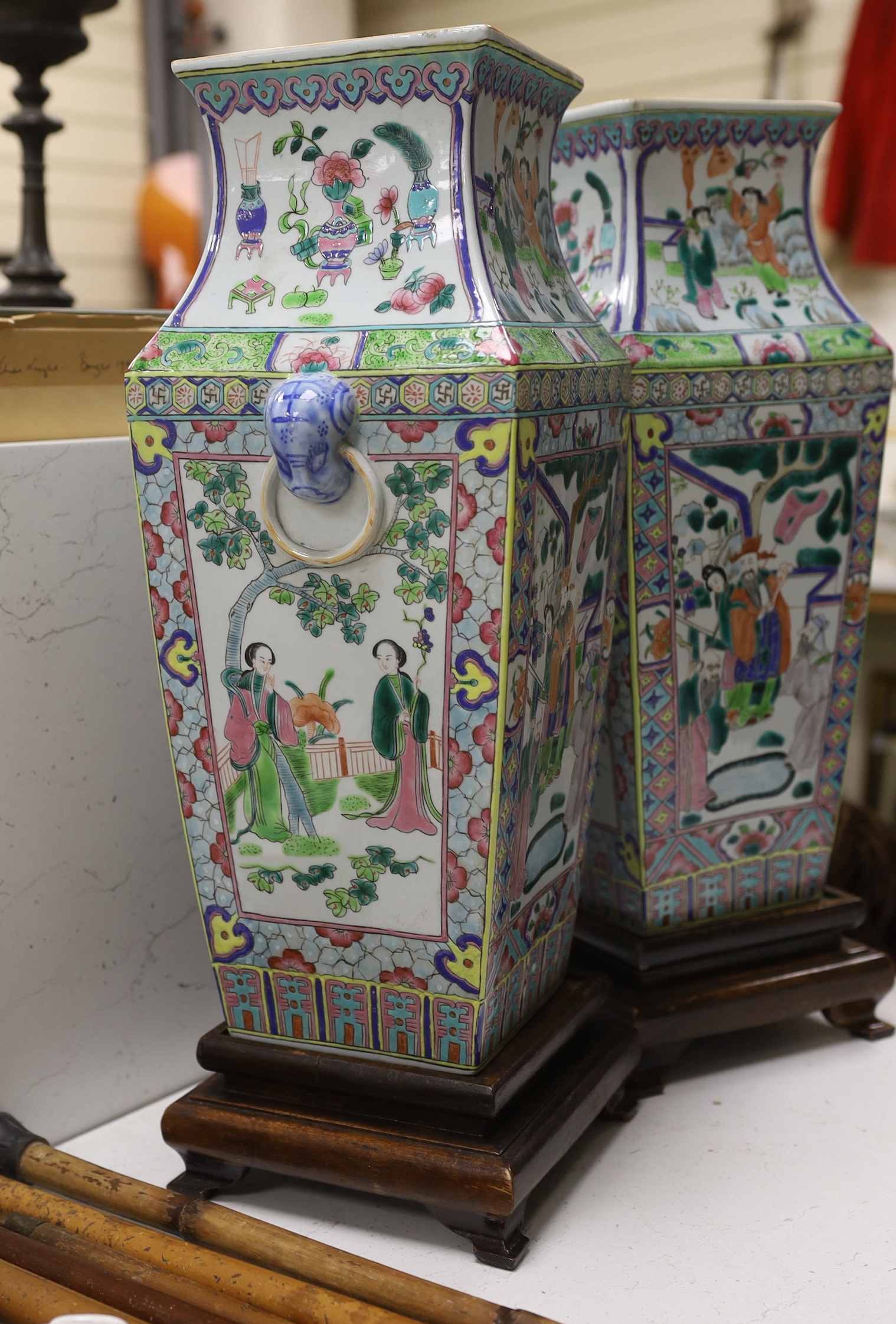 A pair of Chinese famille rose vases, on stands, 49cm total height